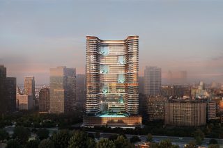 современный небоскреб с изогнутыми балконами на закате