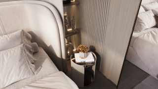 Современный угол спальни с роскошным постельным бельем, прикроватной тумбочкой и цветами
