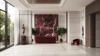 стильное фойе с красной мраморной стеной и комнатными растениями