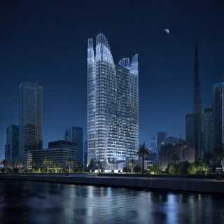 Современный небоскреб Skyhall ночью на фоне горизонта Дубая